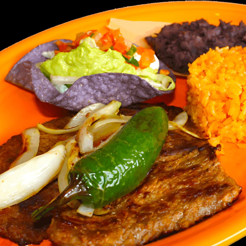 Dos Reales Latin Kitchen's carne asada with grilled onions, jalapeño, rice, black beans, and a taco.